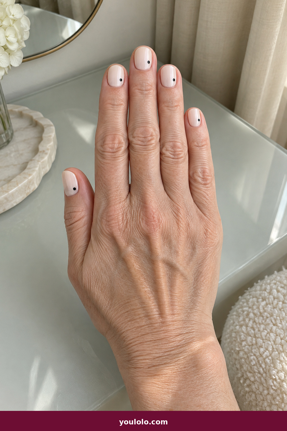 Short Nails Inspo idea 14: Cream and Black Dot, short creamy nails with one small black dot placed off-center