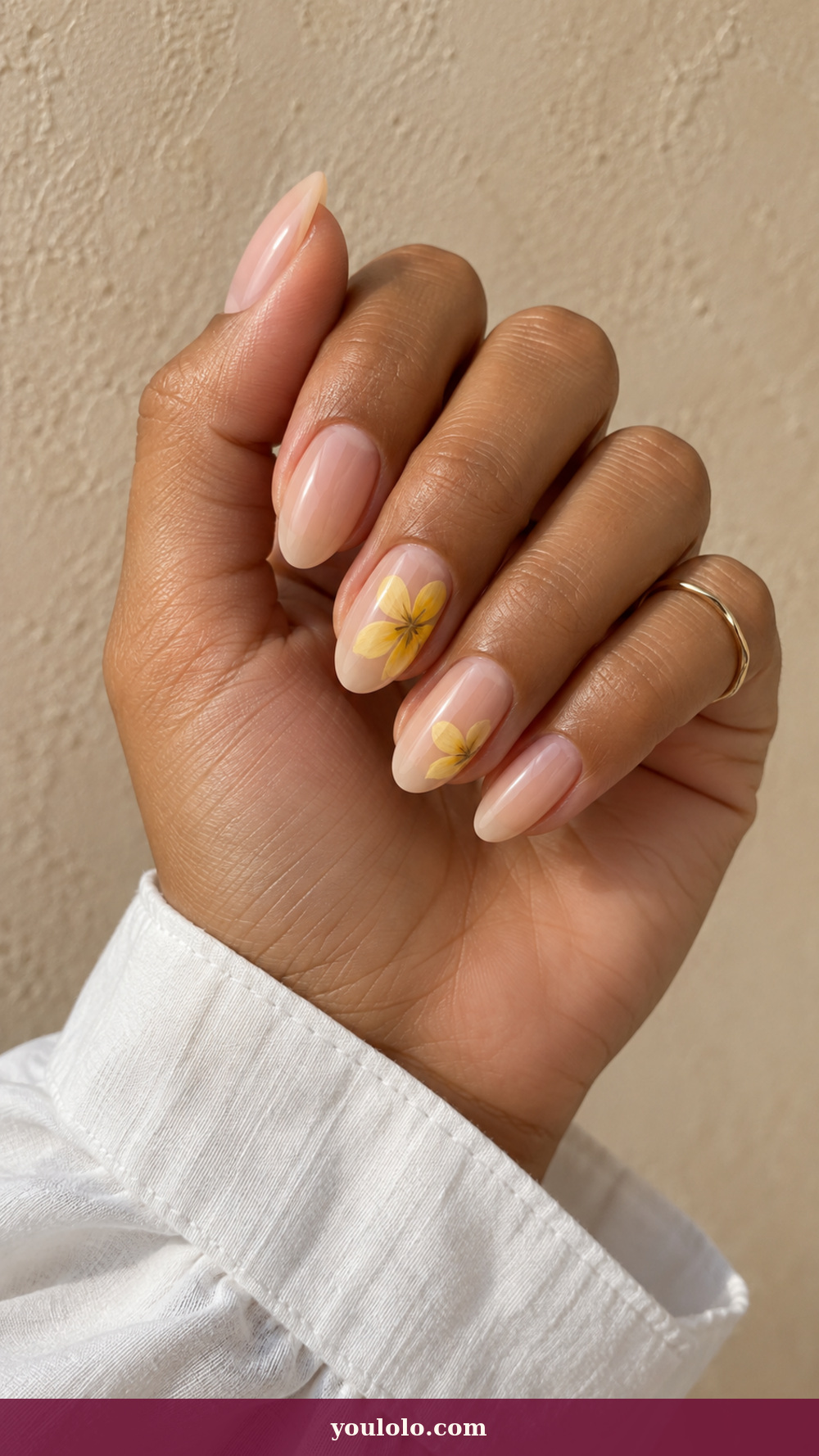 Simple Spring Nails idea 14: Daffodil Brush Mark on a realistic feminine hand
