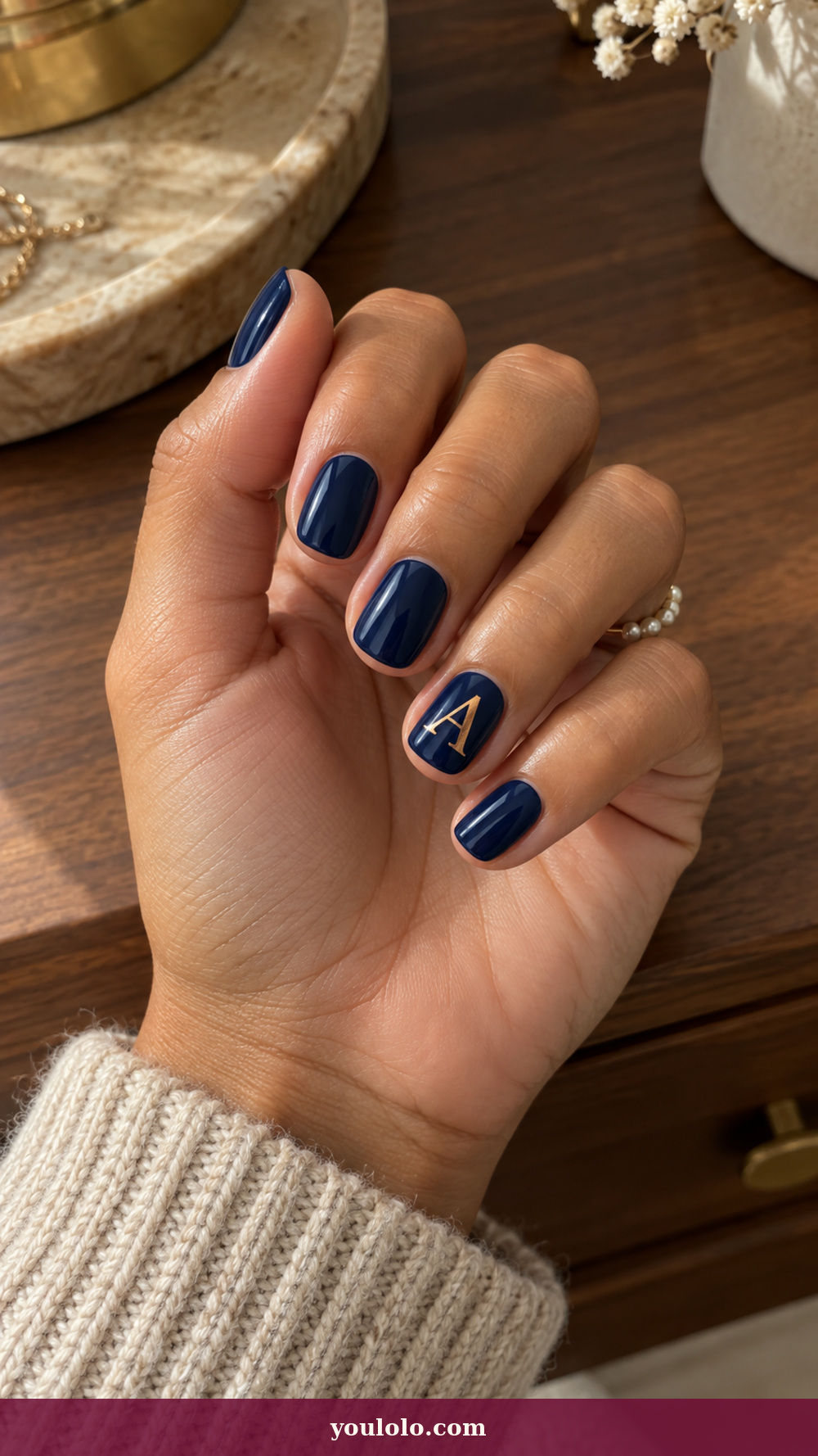 Initial Nails idea 14: Foil-Cut Monogram on a realistic feminine hand