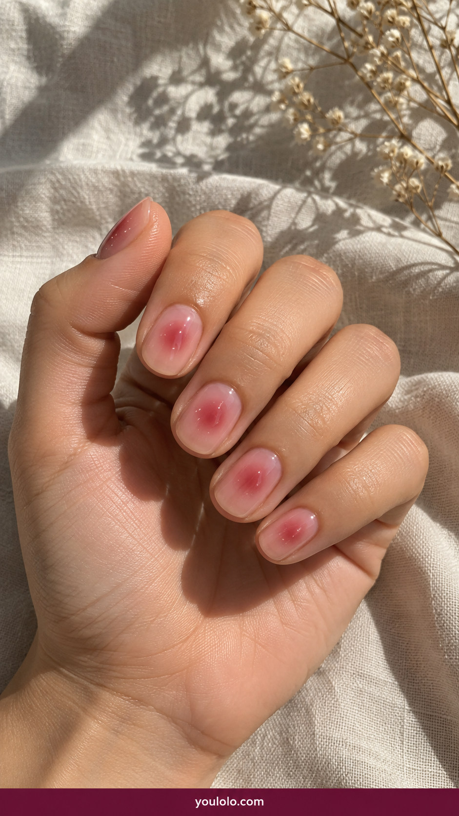 Aura Nails idea 14: short glossy nude nails with tiny raspberry aura bloom on an anatomically realistic feminine hand