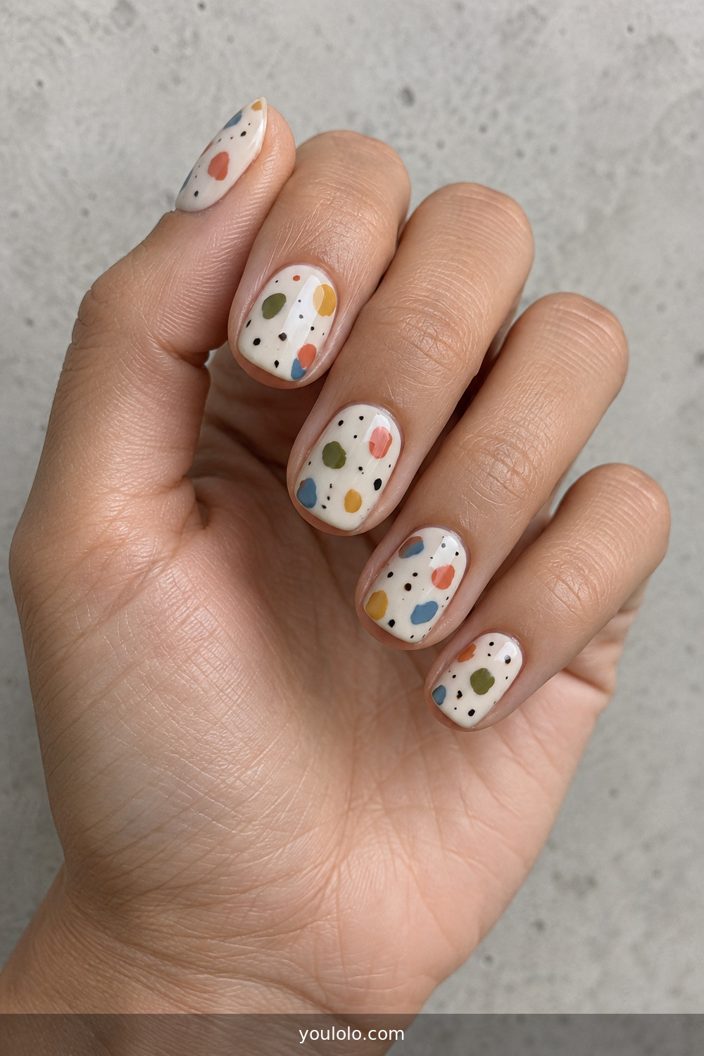 Cream terrazzo nails with colorful painted chips