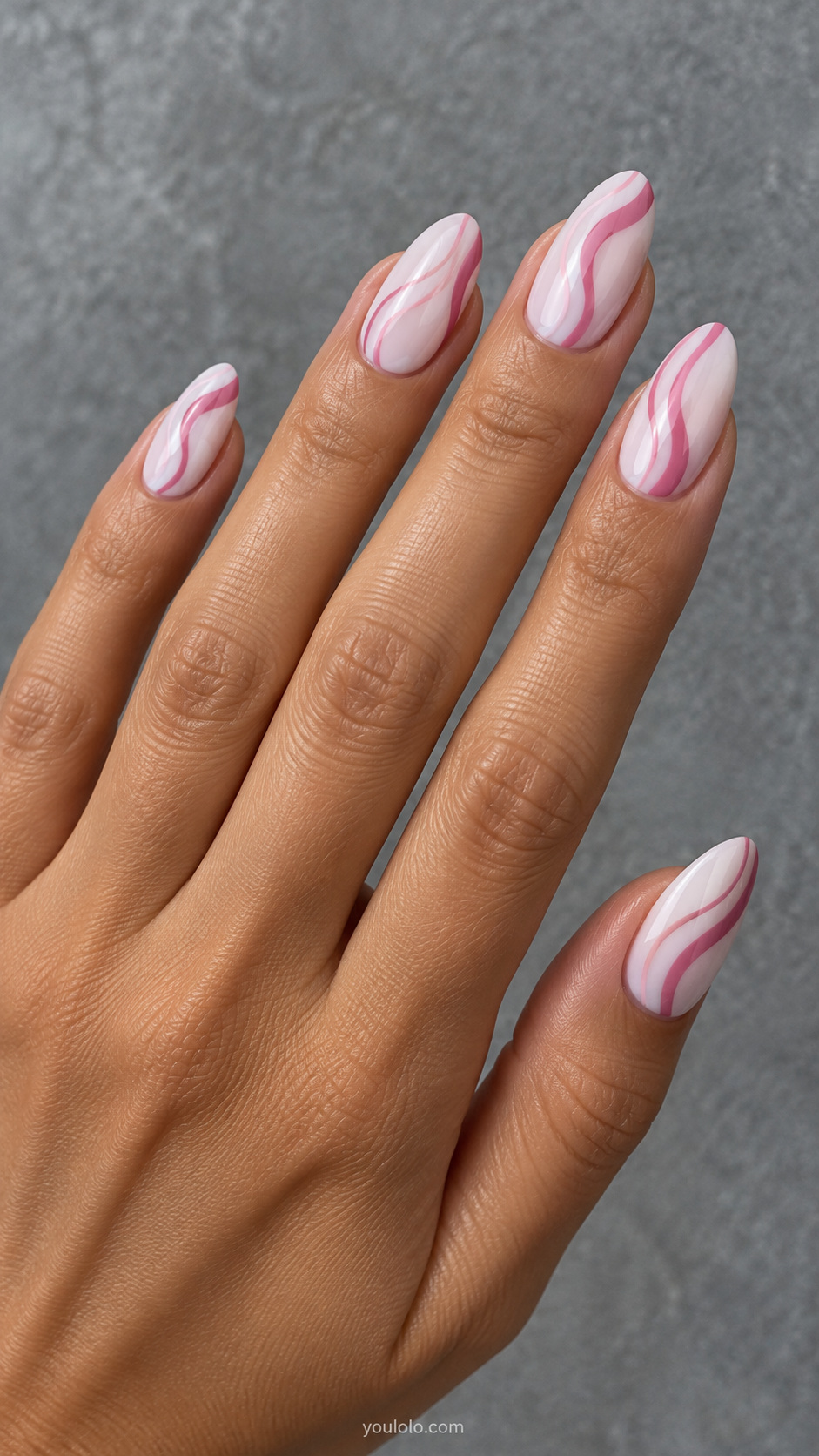 Wavy pink lines on milky white manicure