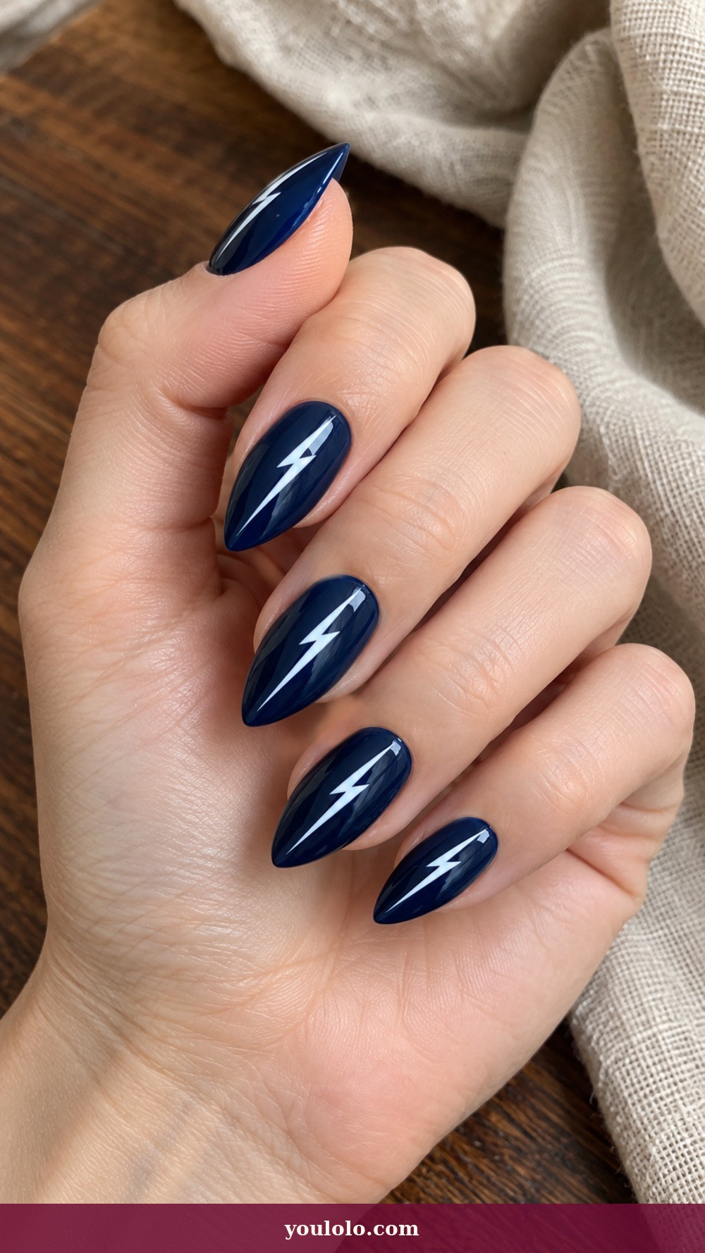 Short Stiletto Nails idea 14: White Lightning Slash on a realistic feminine hand