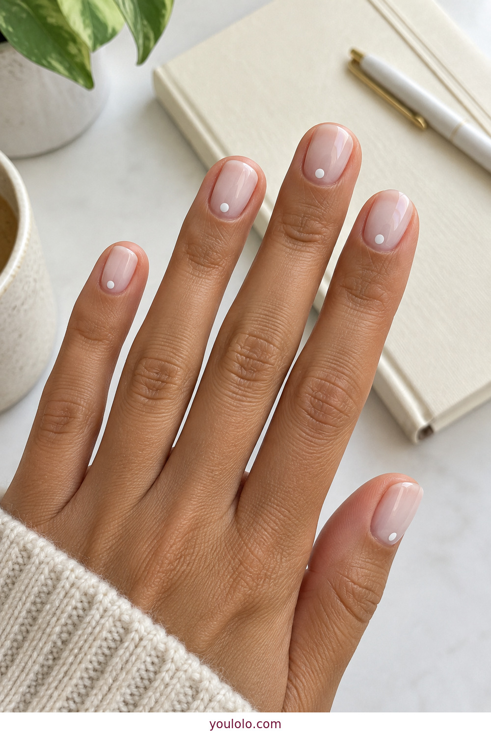 Minimal white dot manicure over short milky nails