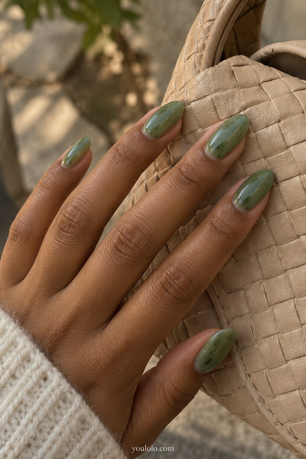 Moss green layered marble manicure with natural color variation