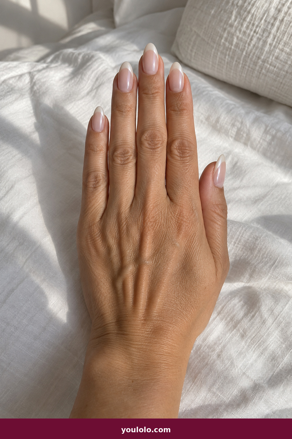 Elegant Almond Nails idea 15: Pearl French Shadow, medium almond nude nails with pearly white tips and a soft shadow line