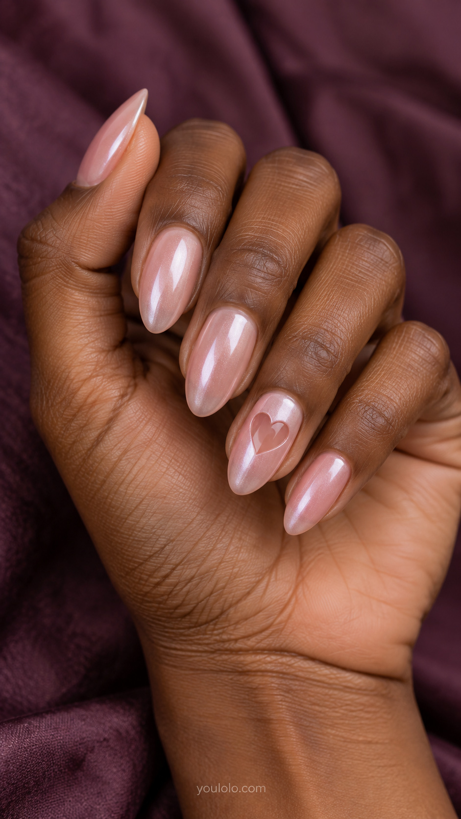 Pink pearl with a translucent heart window manicure