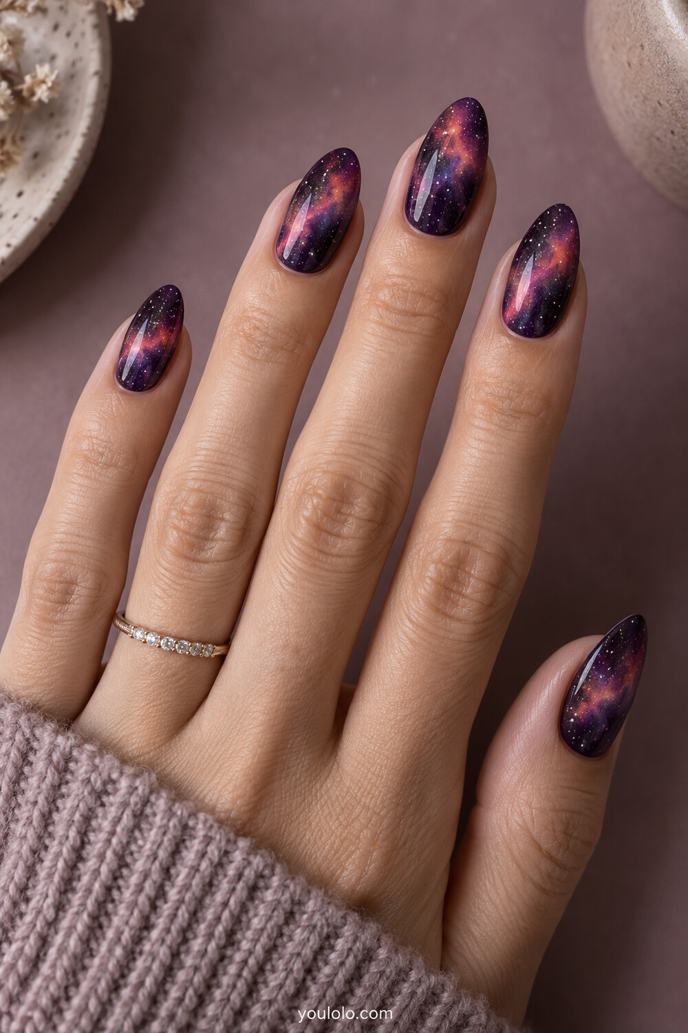 Deep plum nails with coral pink and violet nebula clouds