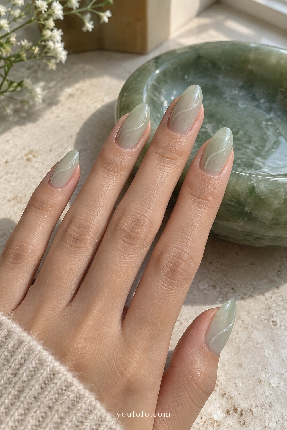 Misty jade marble French tips over a sheer nude base