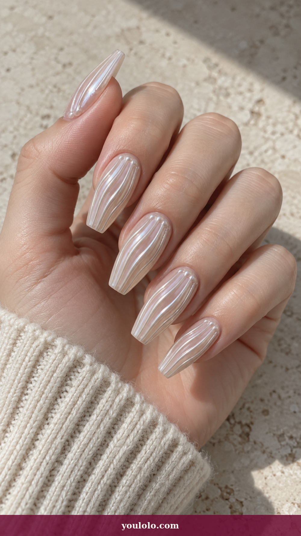 Acrylic Nails Ideas idea 16: Pearl Rib Armor on a realistic feminine hand