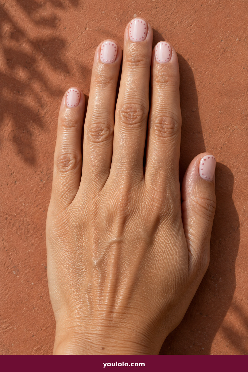 Pink and White Nails idea 17: Blush Polka Border, short milky nails with a neat border of tiny blush-pink dots