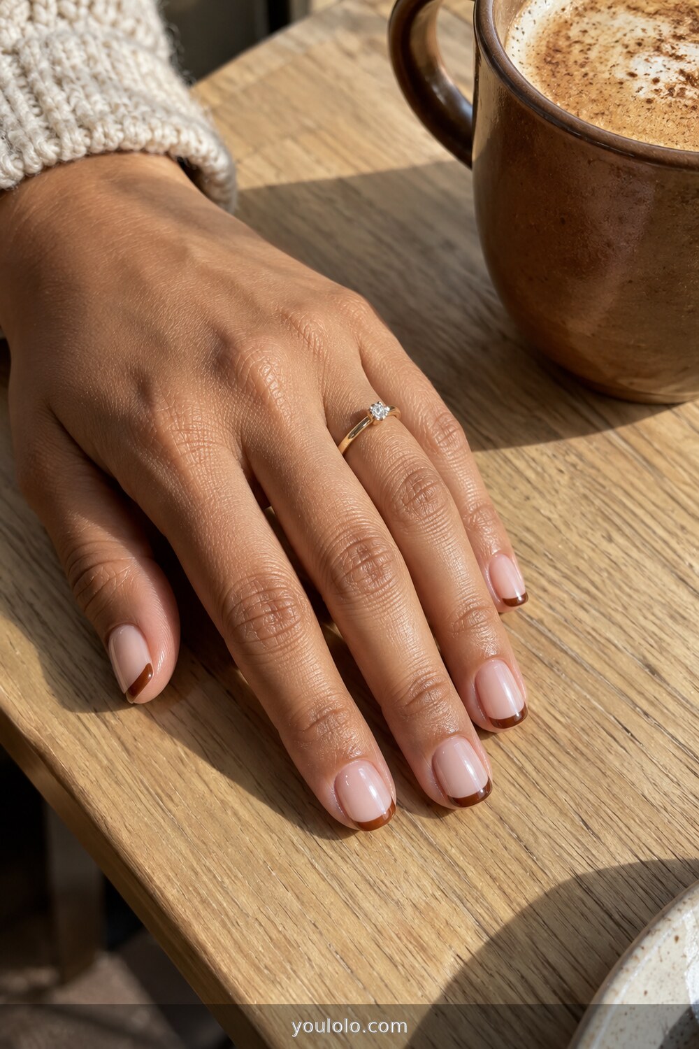 Cinnamon brown micro French tips on a sheer base