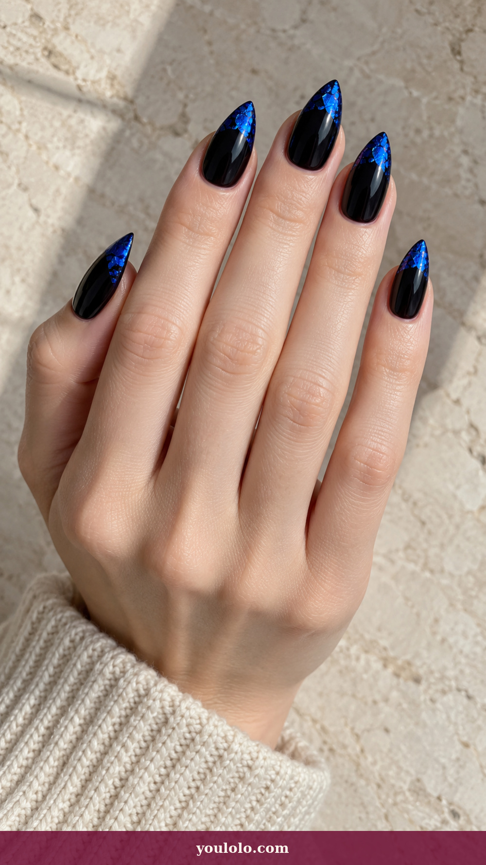 Short Stiletto Nails idea 17: Electric Blue Foil Edge on a realistic feminine hand
