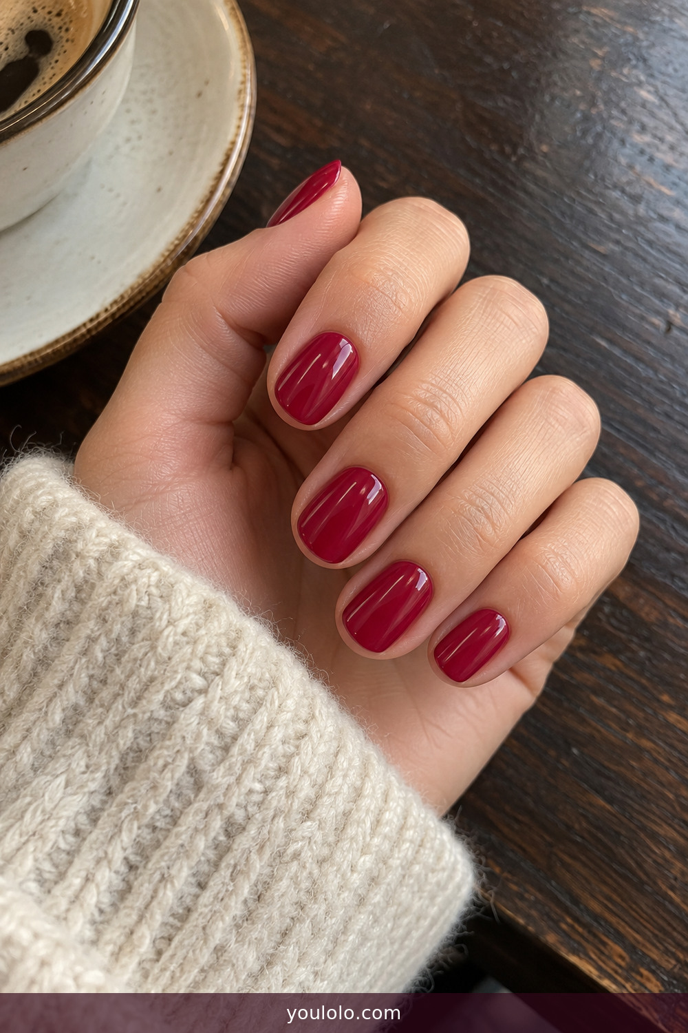 Glossy raspberry jam shade on short oval nails
