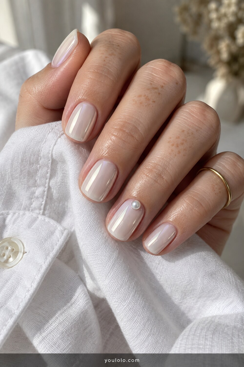 Short Milky White Chrome Nails with one tiny pearl accent