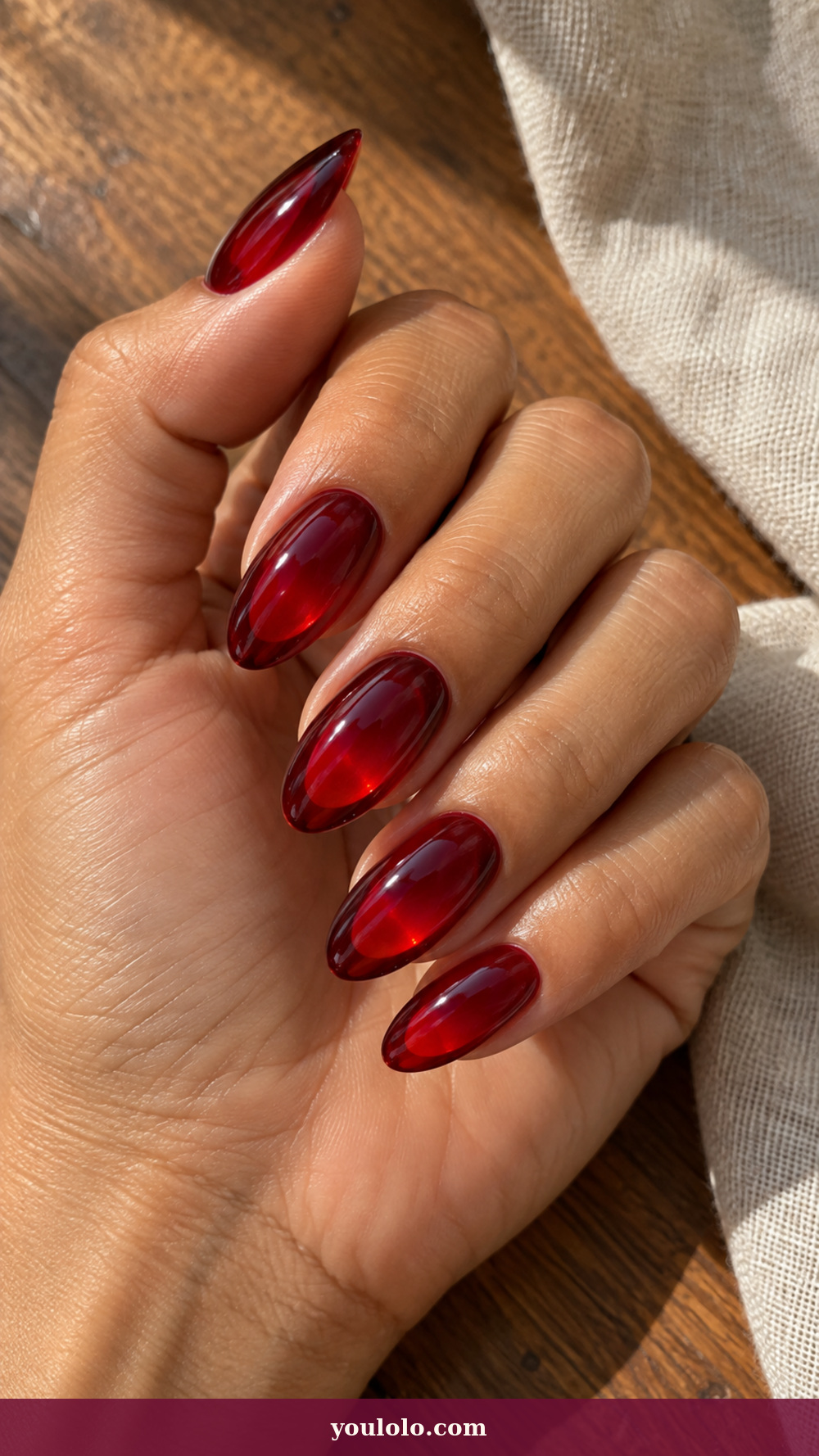 Acrylic Nails Ideas idea 17: Transparent Red Lens on a realistic feminine hand