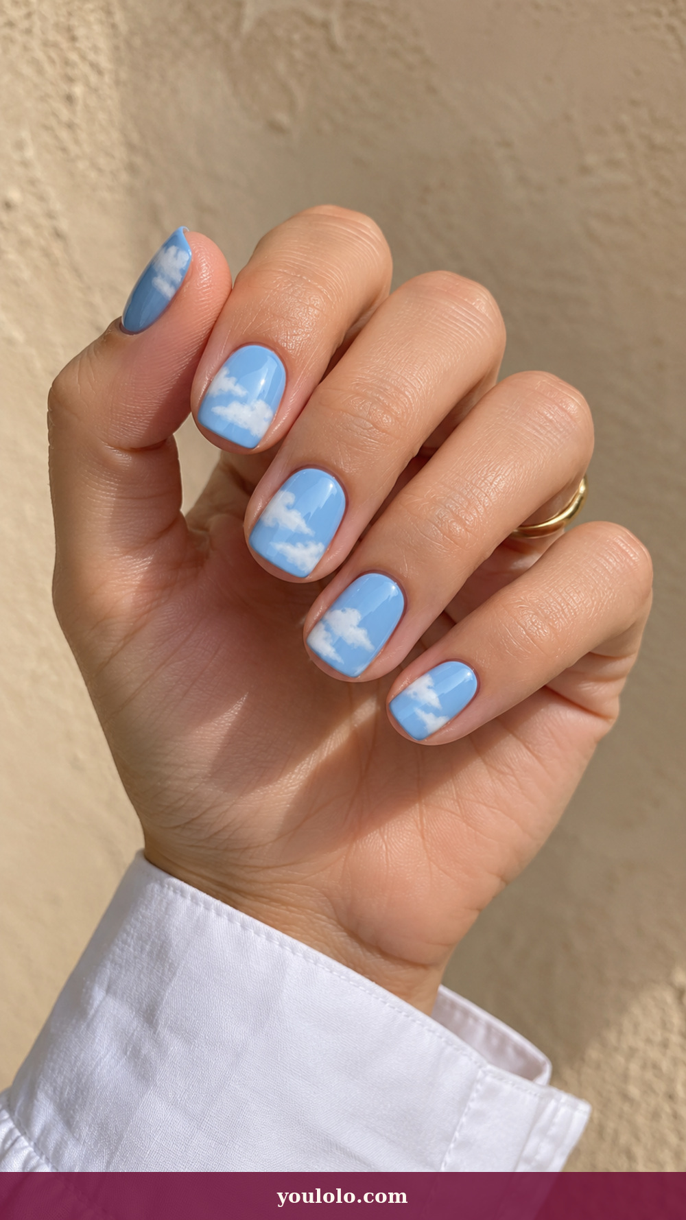 Simple Spring Nails idea 18: Cloud White Sweep on a realistic feminine hand
