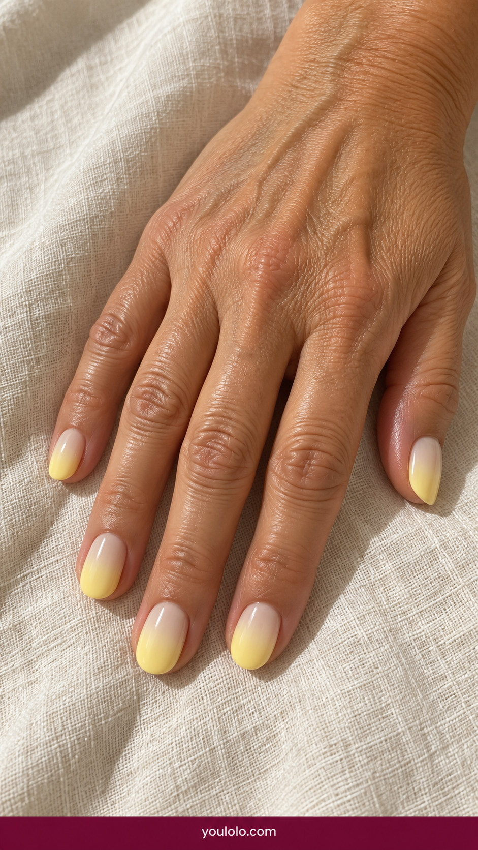 Butter Yellow Nails idea 18: cream-to-butter-yellow gentle ombre on short oval nails on an anatomically realistic feminine hand