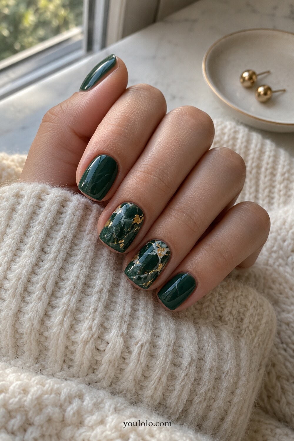 Dark emerald gemstone manicure with glossy dimensional layers
