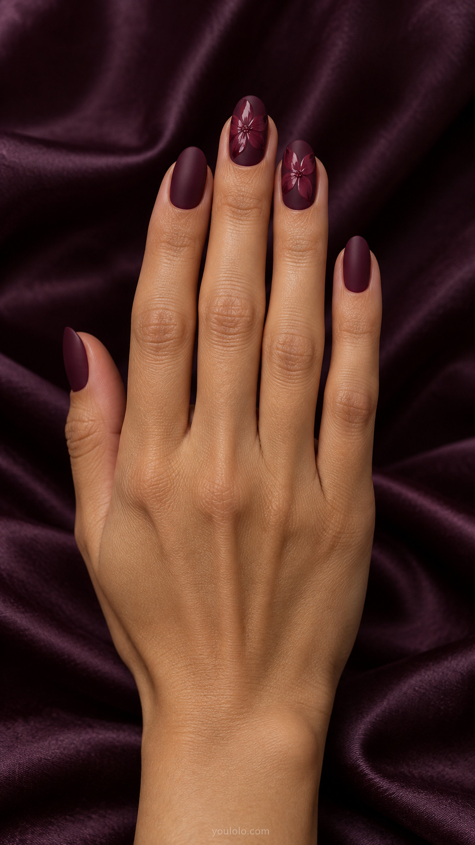 Matte Wine with Gloss Petals — Medium oval nails; matte deep burgundy nails with slightly lighter glossy burgundy flower petals on two accent nails.