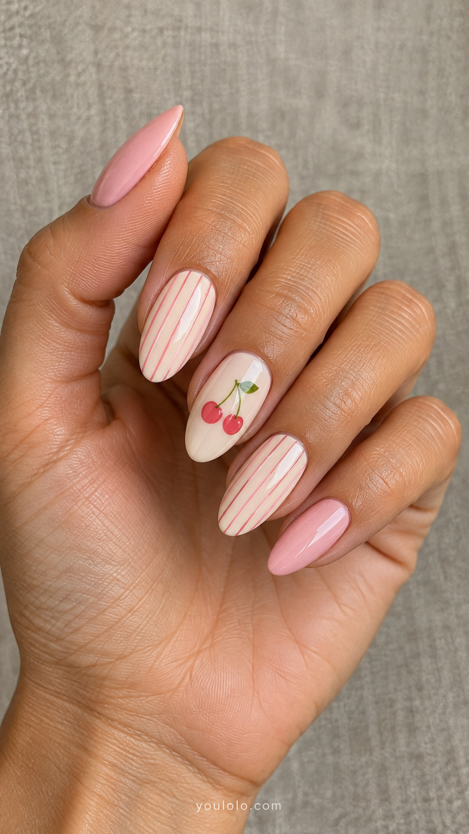 Pink stripes with small cherry accents manicure