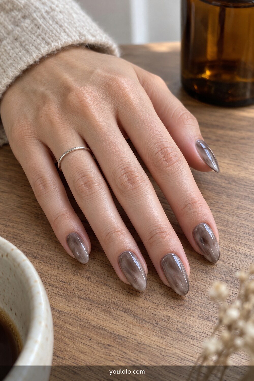 Translucent smoky quartz almond nail design