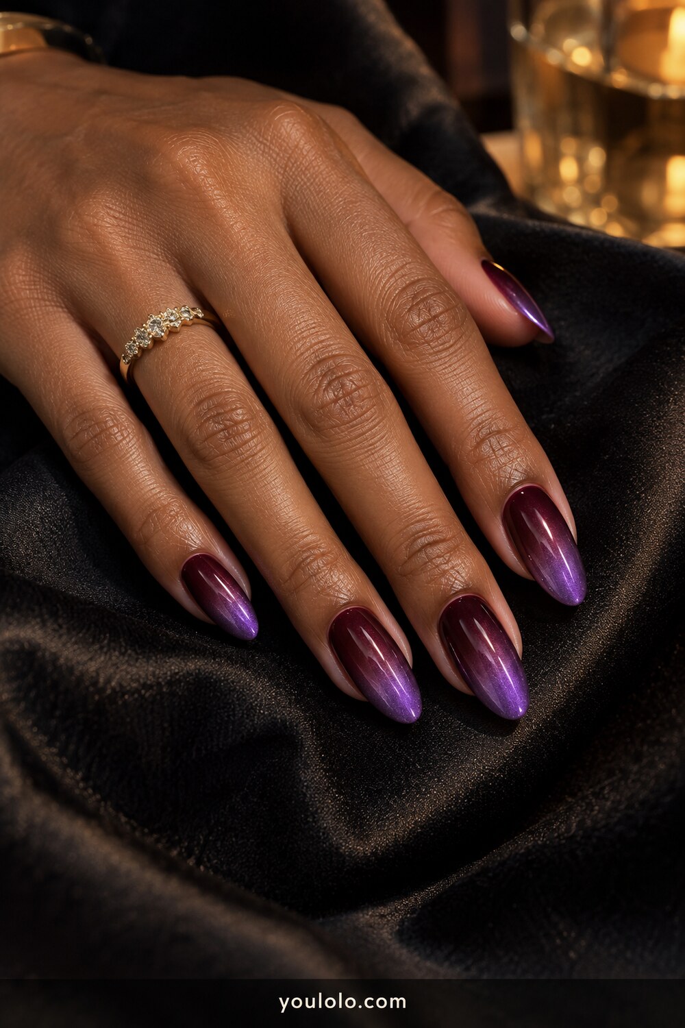 Wine to violet chrome ombre on almond nails