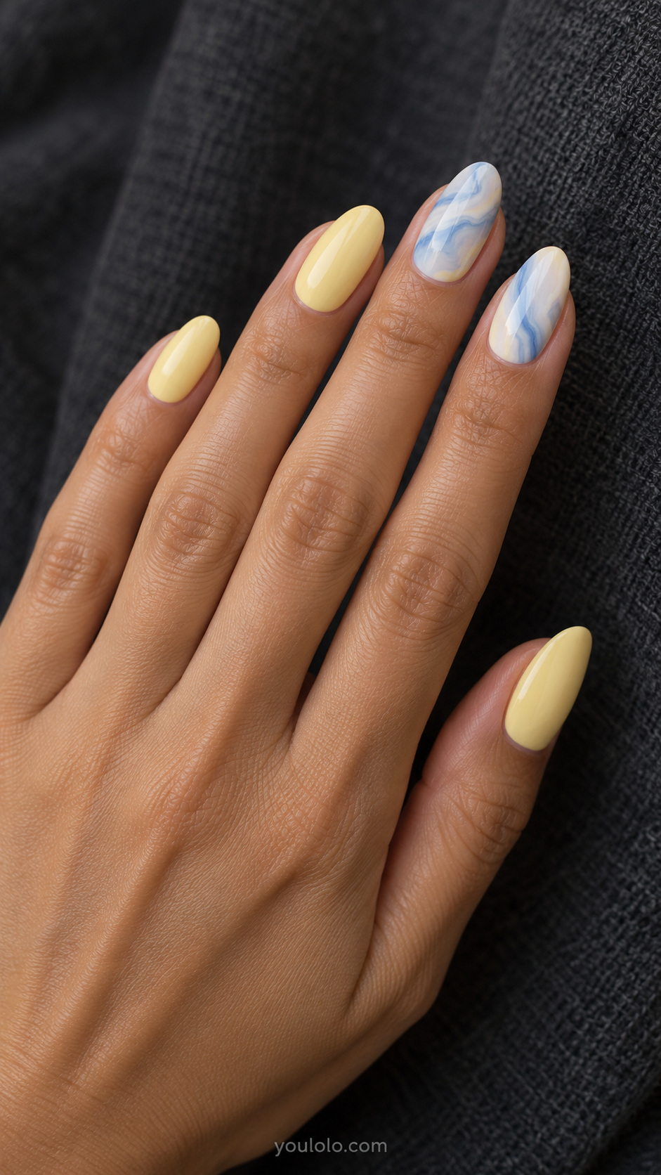 Blue marbling with solid butter yellow manicure