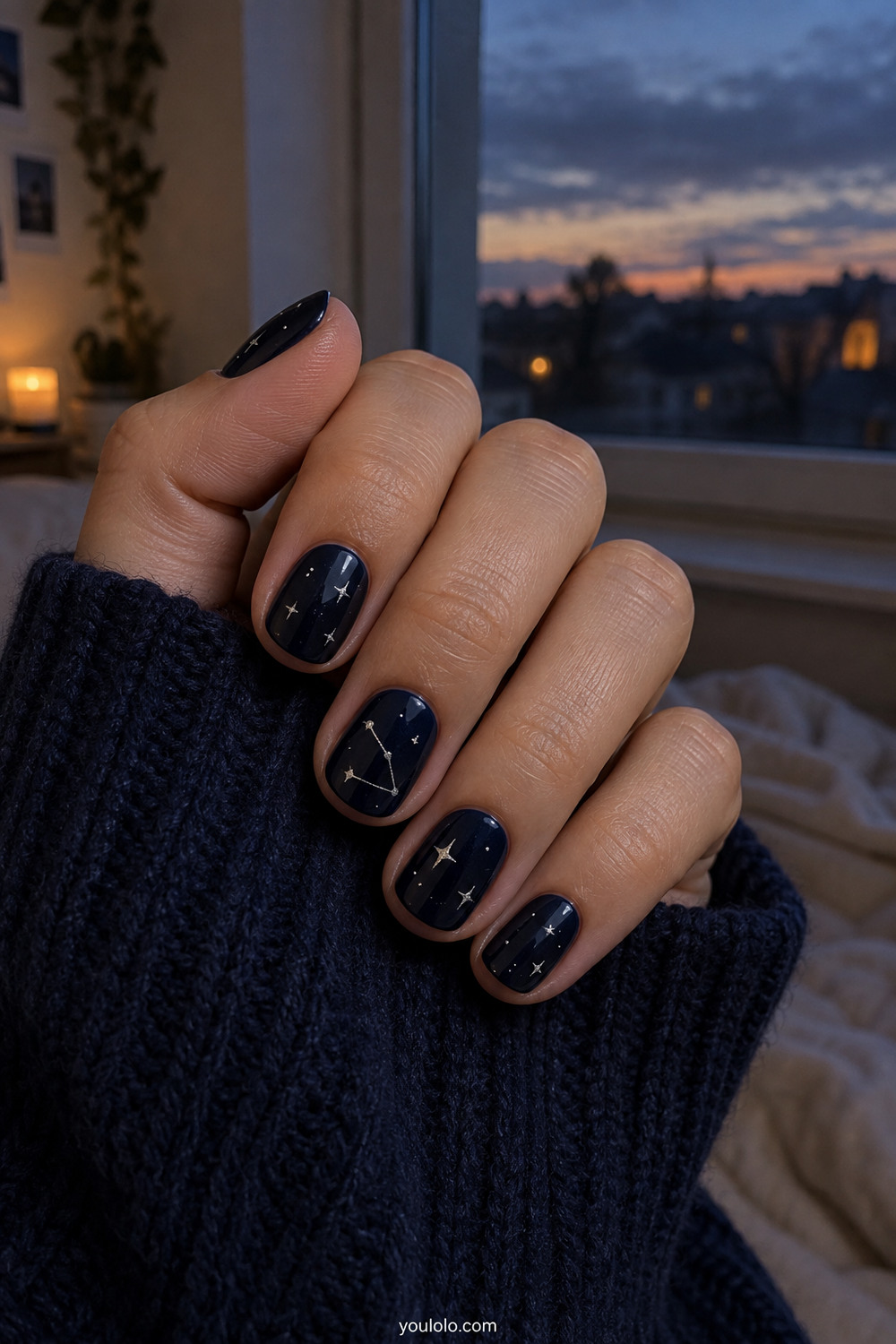 Midnight navy short nails with sparse silver constellation art