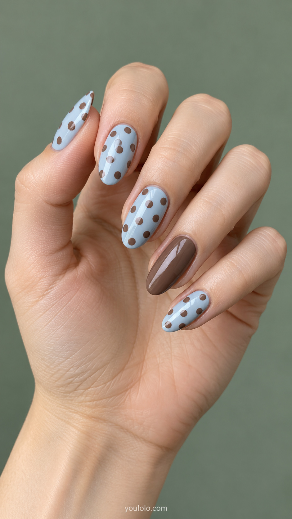 Mocha dots on a pale blue base manicure