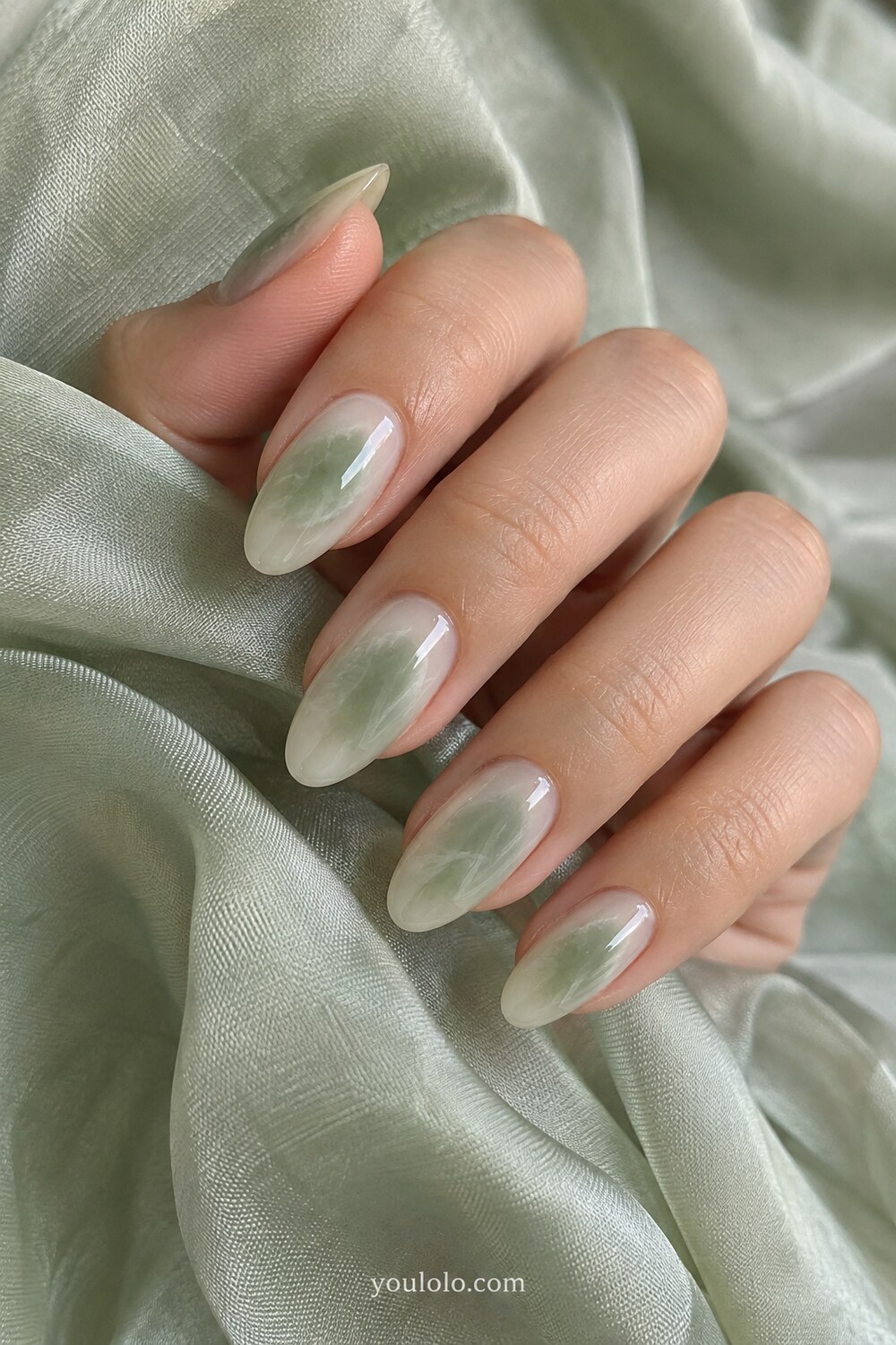 White jade ombre fading into pale green at the tips