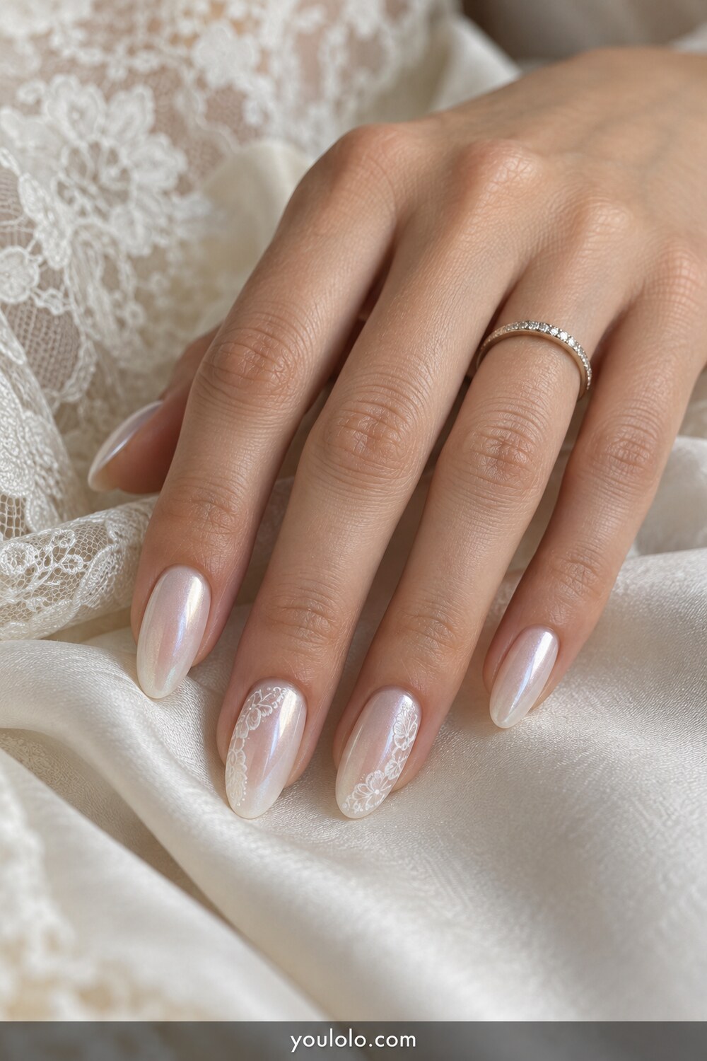 Bridal milky pearl chrome nails with delicate lace accents