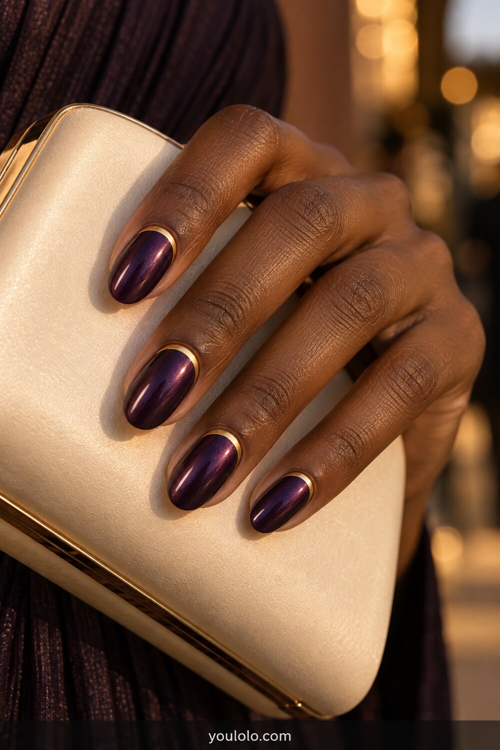 Dark amethyst chrome nails with fine gold cuticle cuffs