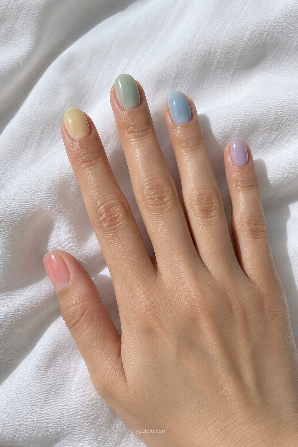 Pastel rainbow Korean jelly manicure in peach lemon mint blue and lilac