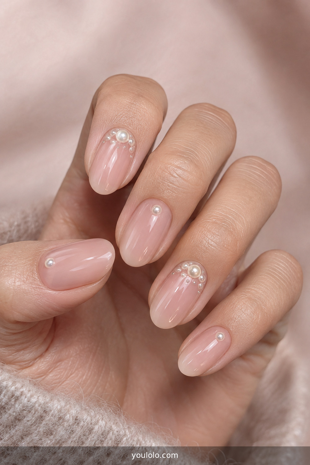 Sheer pink nails with small pearl bubble accents