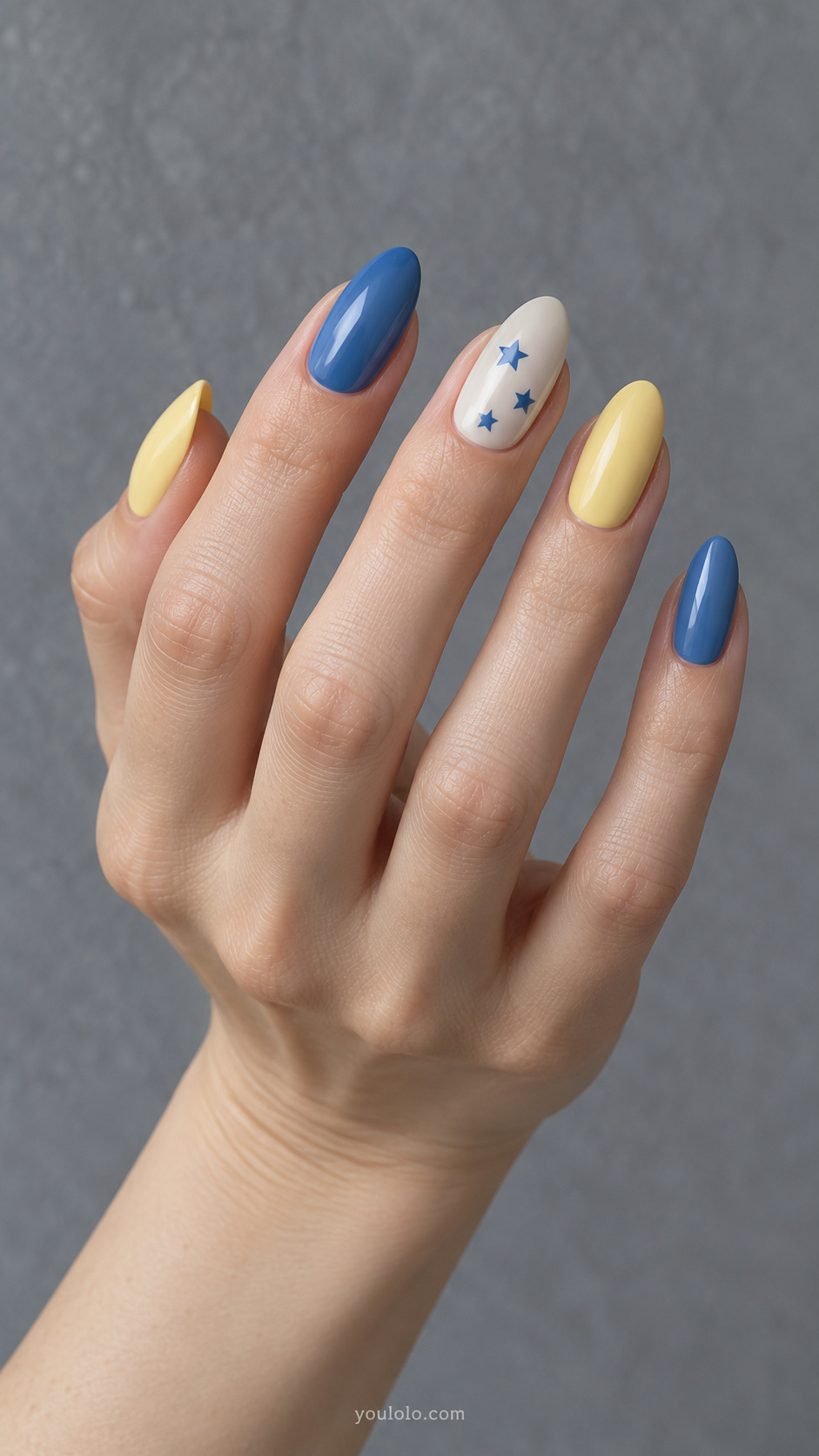 A tiny blue star constellation manicure