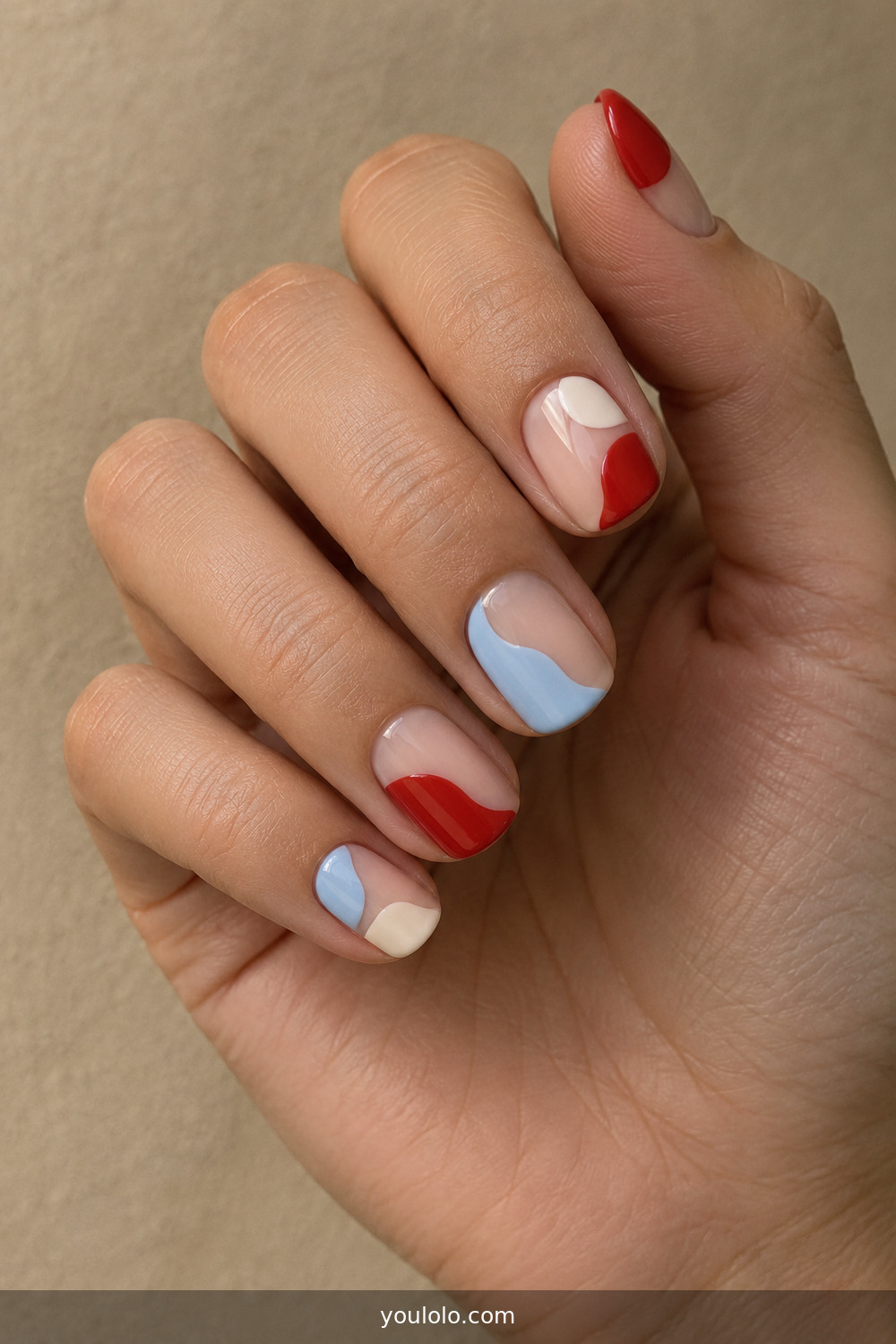 Asymmetric red blue and cream color-block nails
