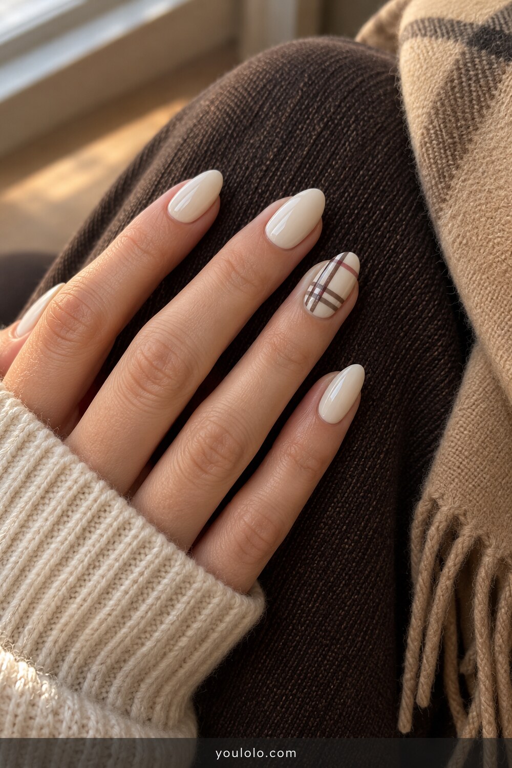 Cream almond nails with one cocoa and burgundy plaid accent