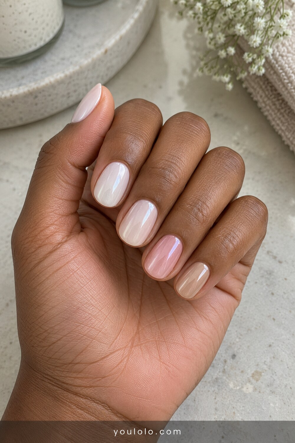 Tonal milk to blush chrome skittle manicure