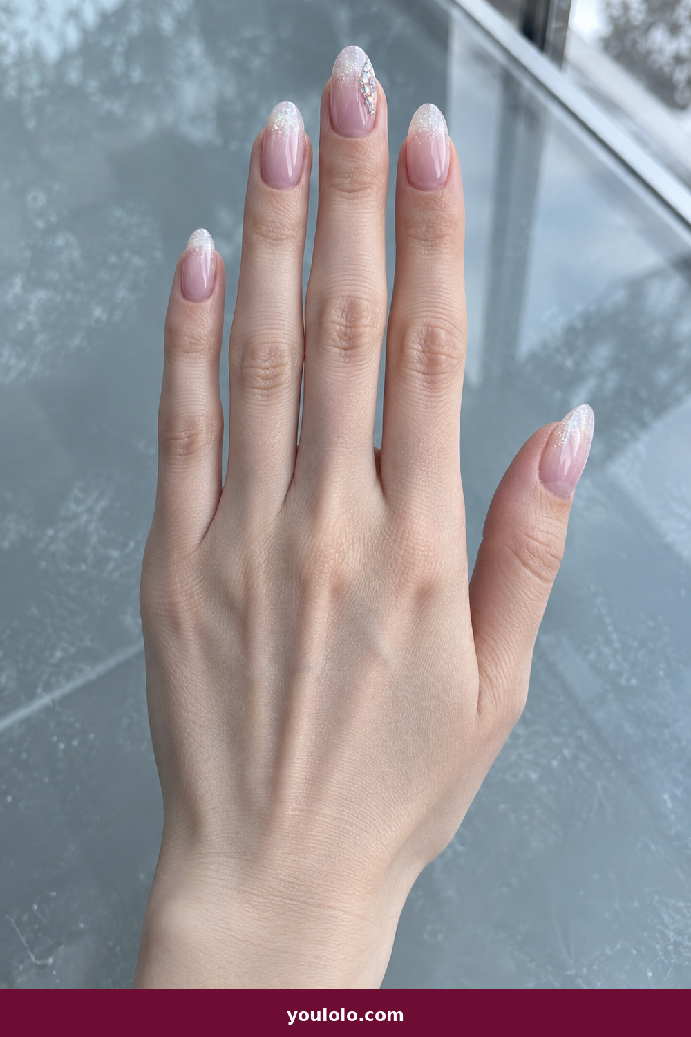 Pink Nails with Rhinestones on One Finger Ideas: Frosted Rose Ice Tips, Cool-pink oval nails with frosted white-to-rose ice tips and an aurora crystal cluster on the middle finger.