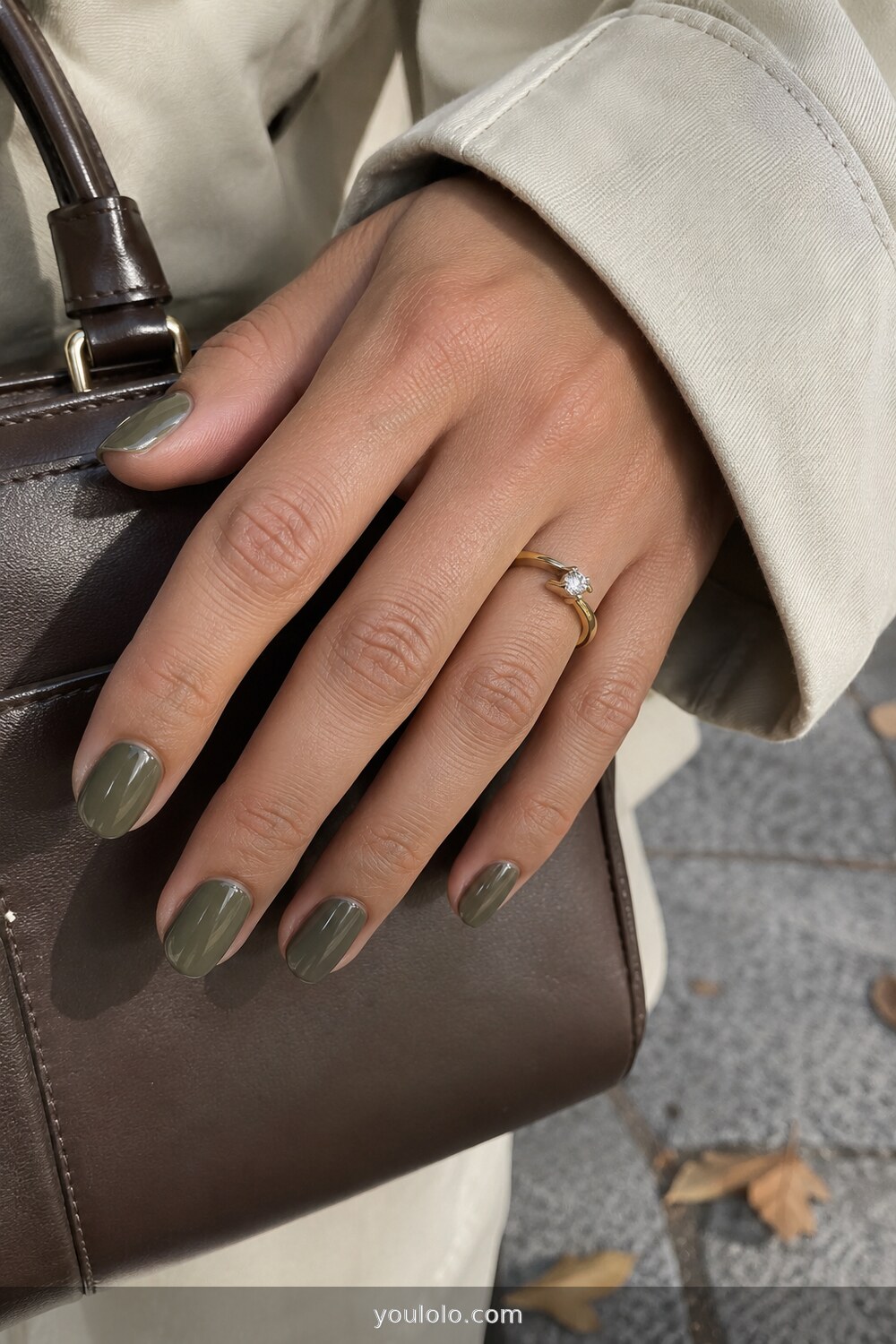 Glossy khaki green nails with an ivory trench coat