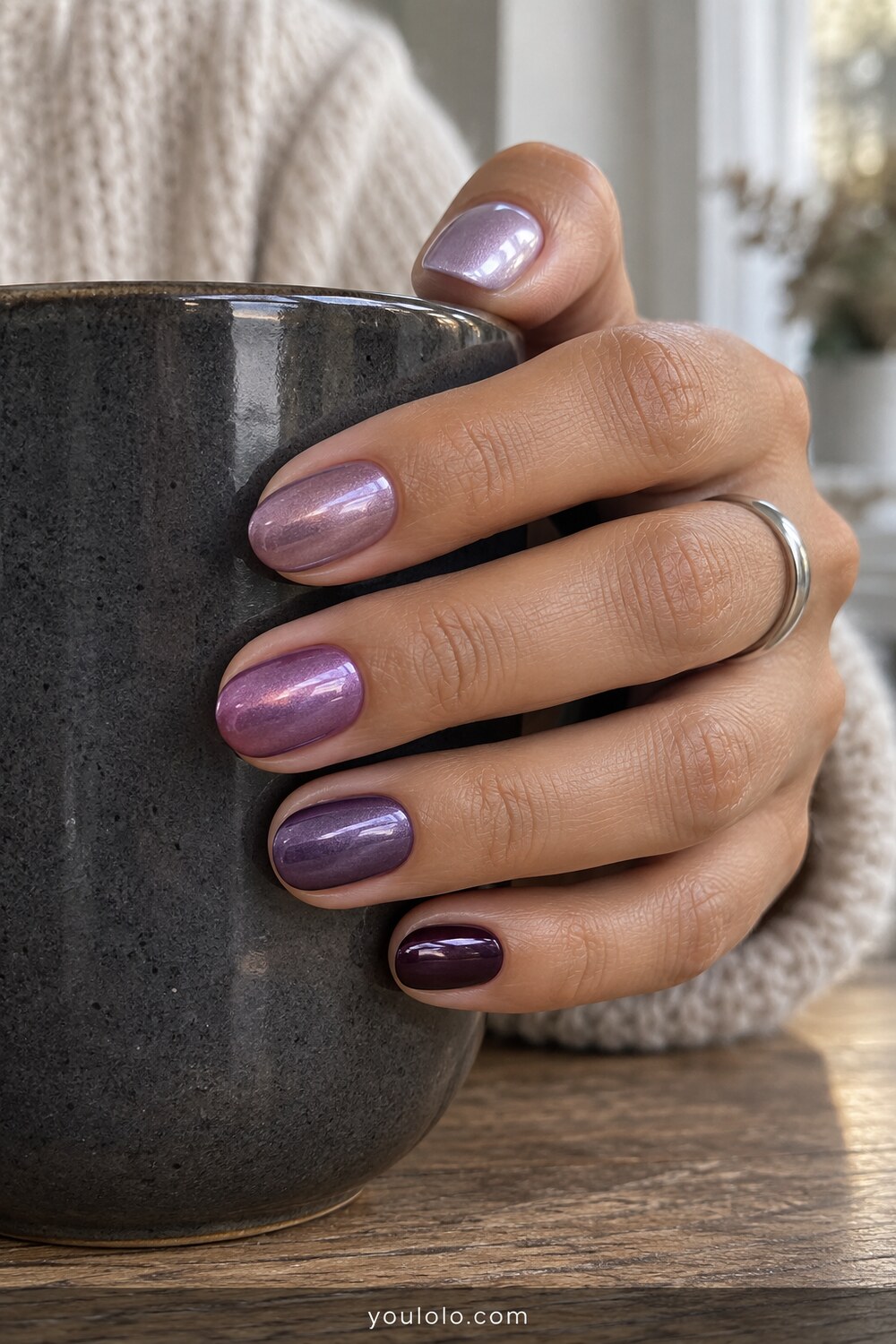 Purple tonal chrome skittle manicure from lilac to plum