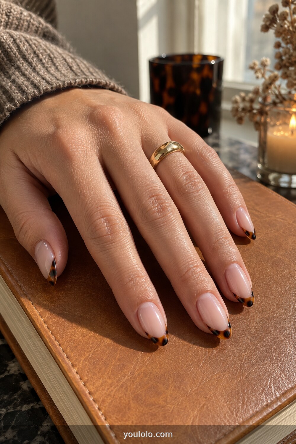 Tortoiseshell micro tips on nude almond nails