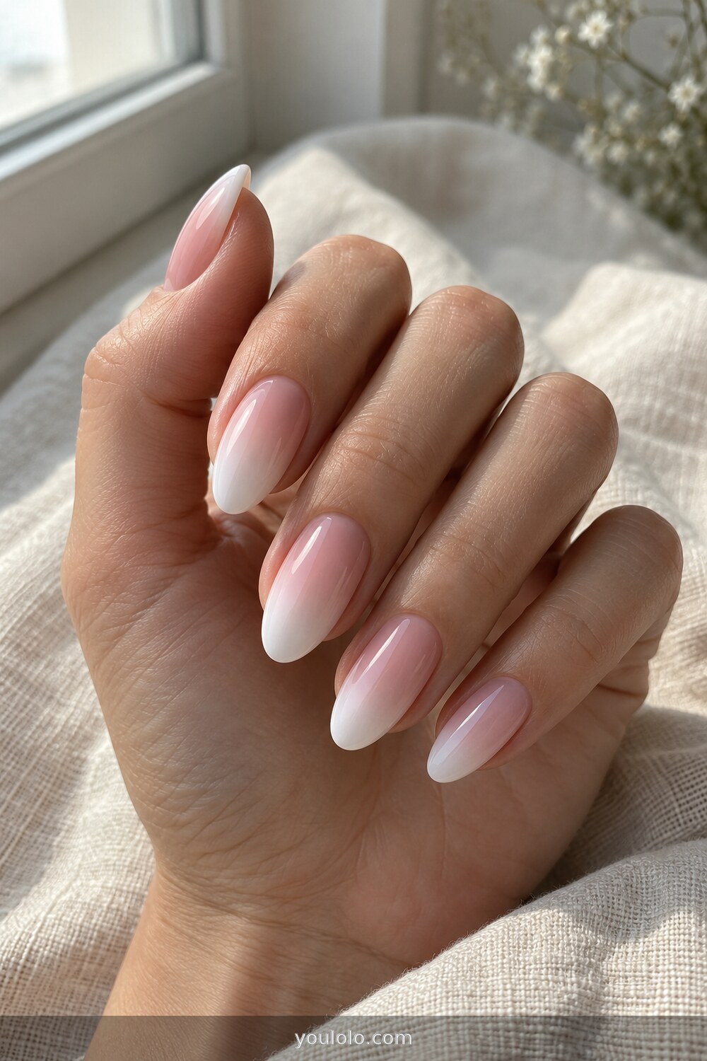 Soft blush to milky white ombre almond nails