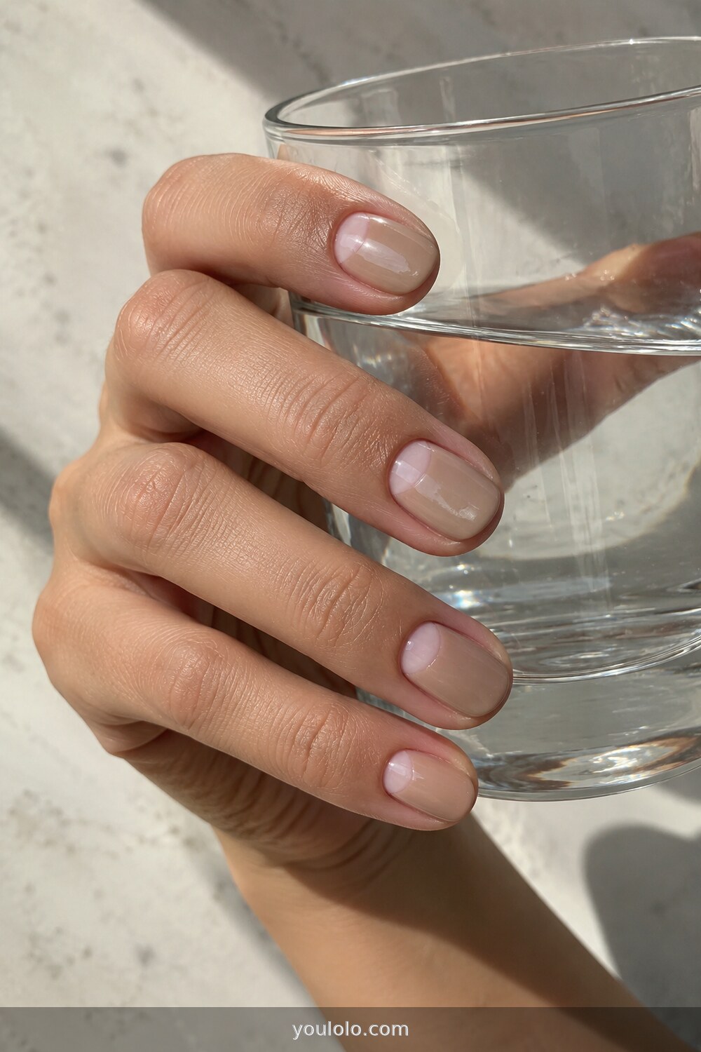 Negative space half moon crescents on short neutral nails