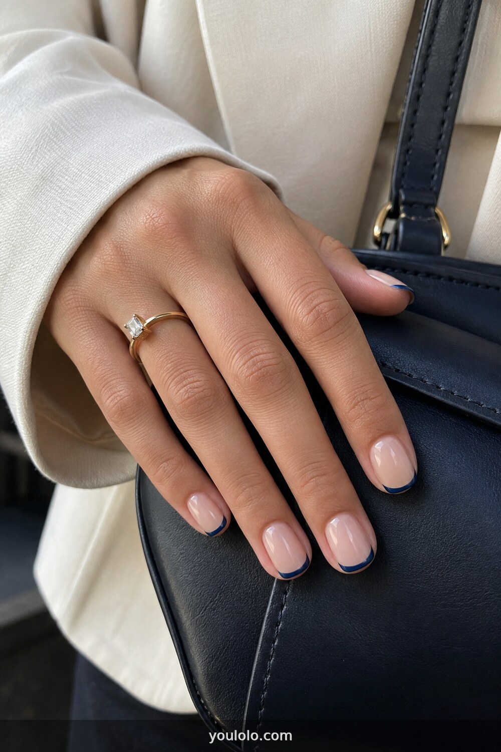 Navy blue micro French tips on short nude nails