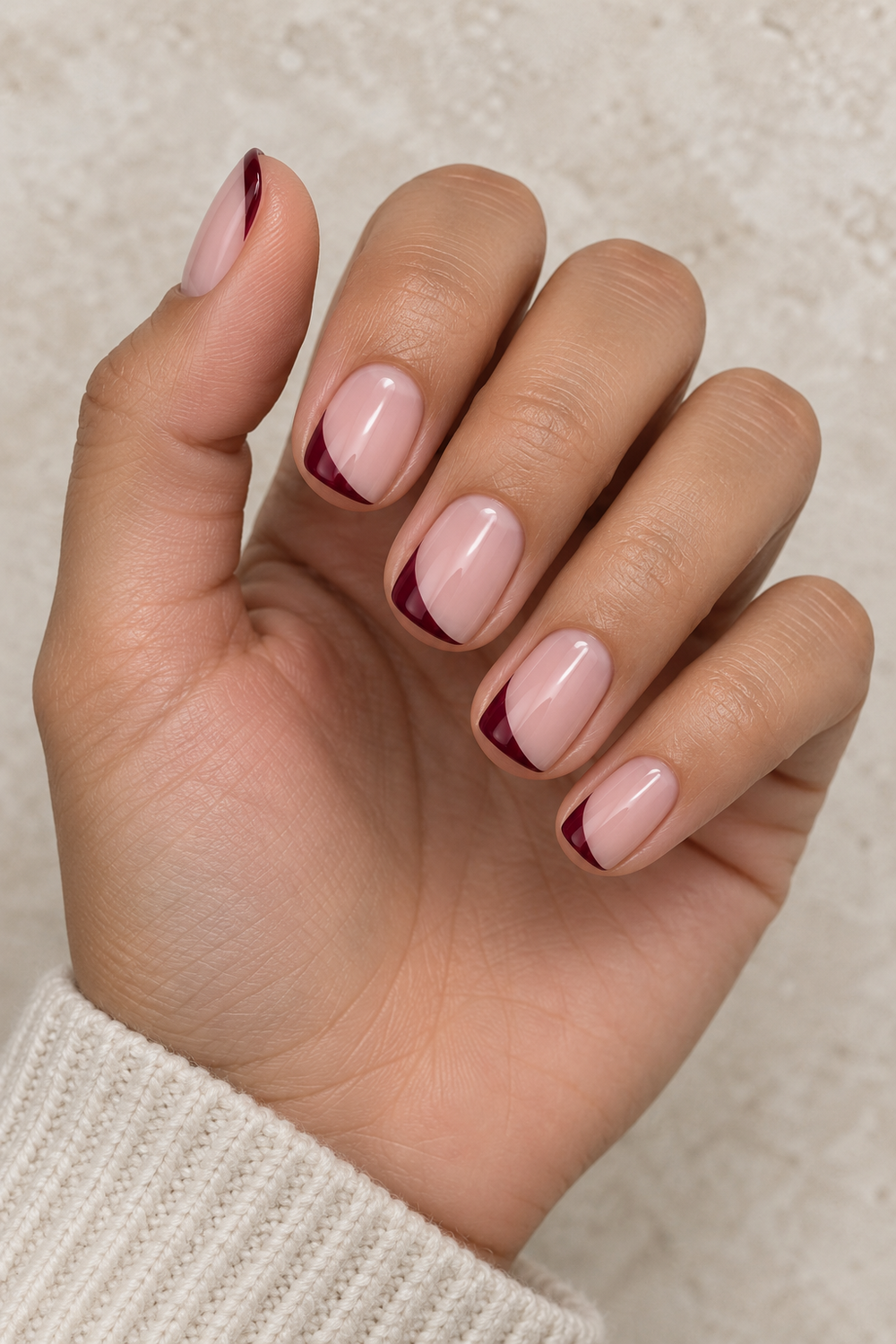 Asymmetric burgundy side French tips on short nails