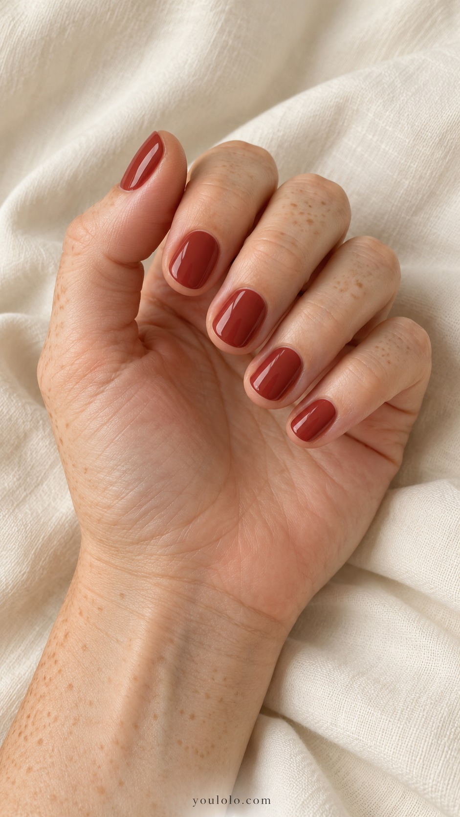 Very short round nails solid muted brick red opaque cream gloss no art