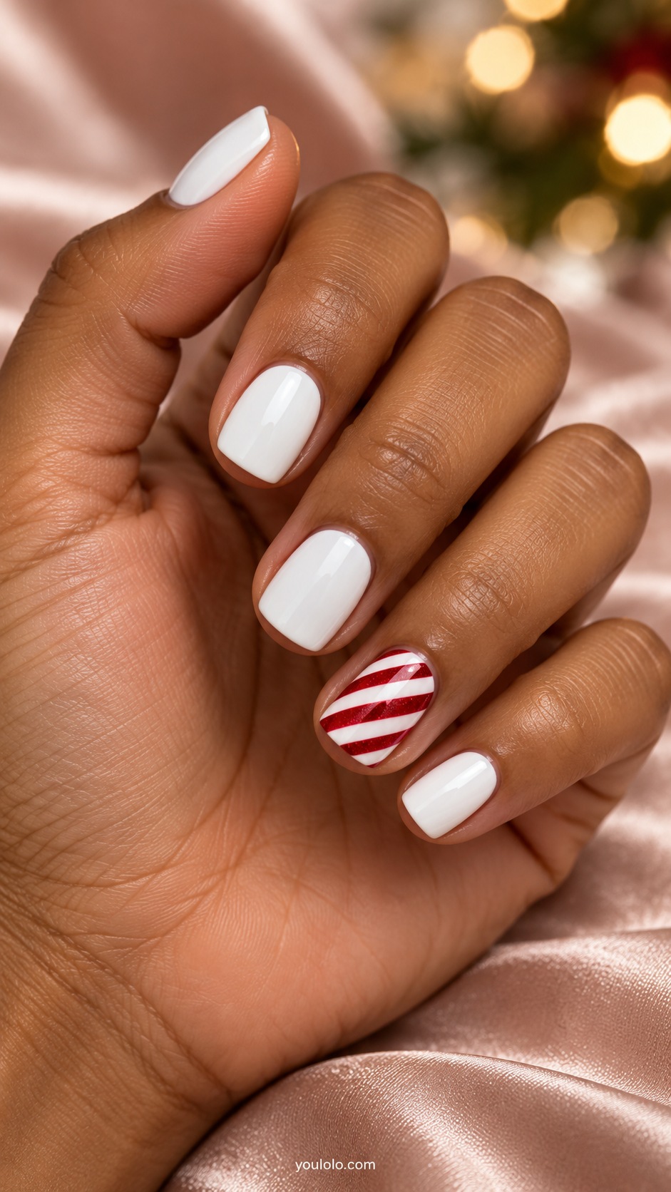 Short square white nails one ring nail crisp diagonal red candy cane stripes