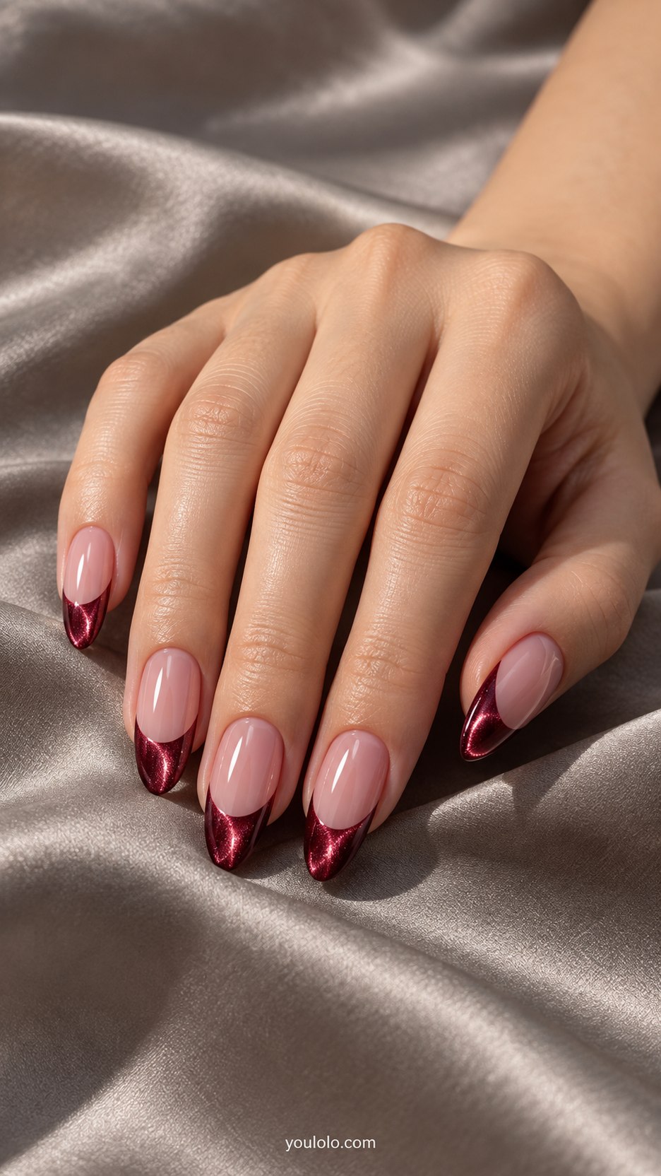 Burgundy Velvet French: medium almond sheer pink nails, deep burgundy magnetic velvet French tips with soft luminous edge